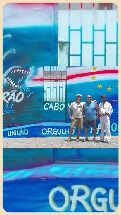 Aficionados de Cabo Verde pintan mural.