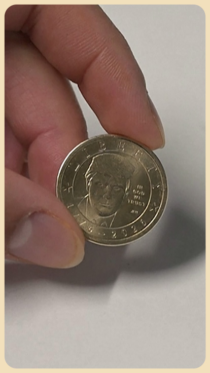 Moneda con el rostro de Donald Trump