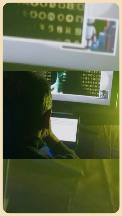 Persona mira computadora en la oscuridad.